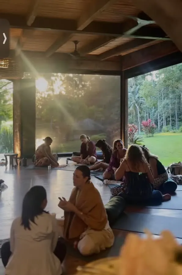 Women's circle at golden hour in the shala