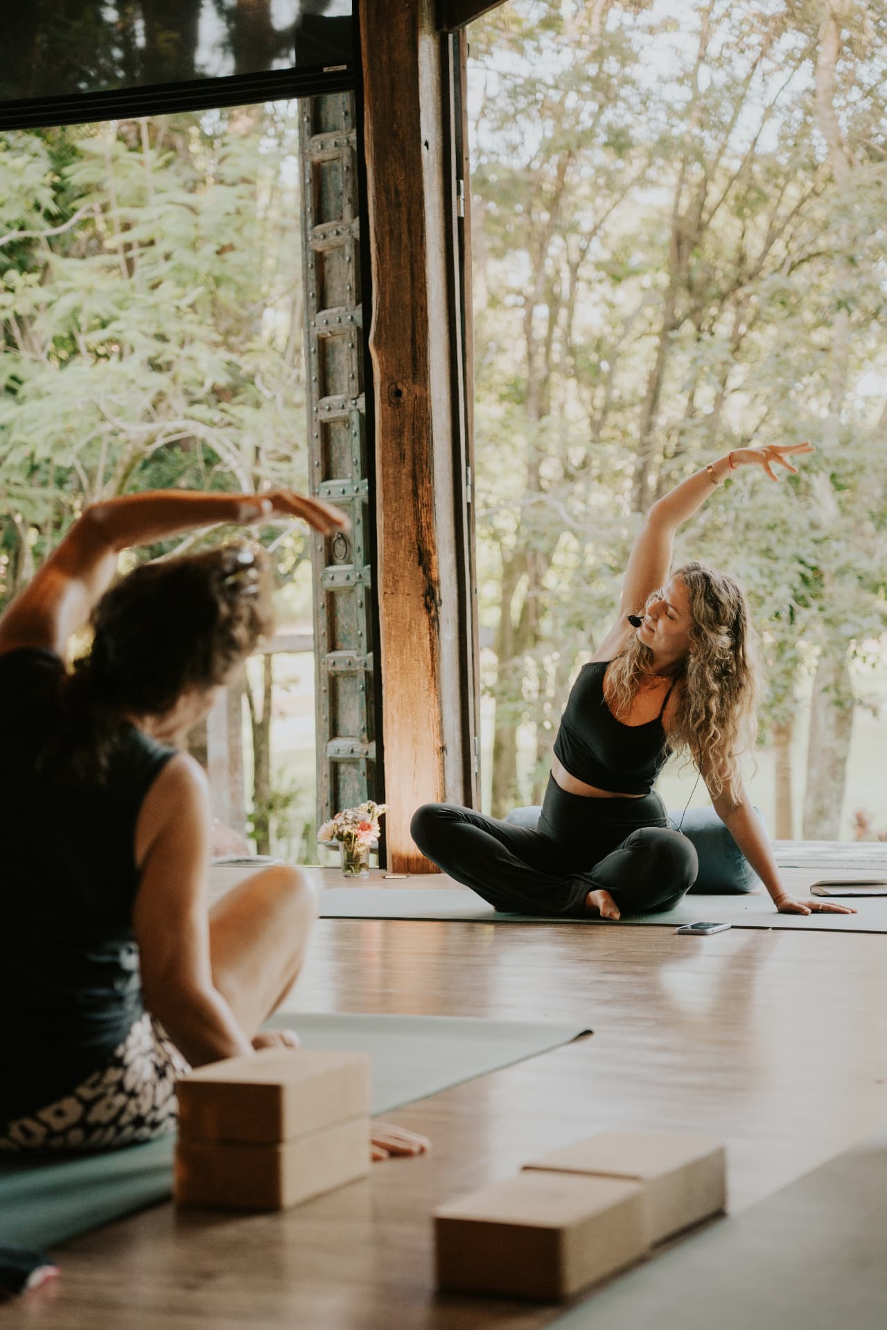 Guided movement in the open-air shala at an Elementa retreat