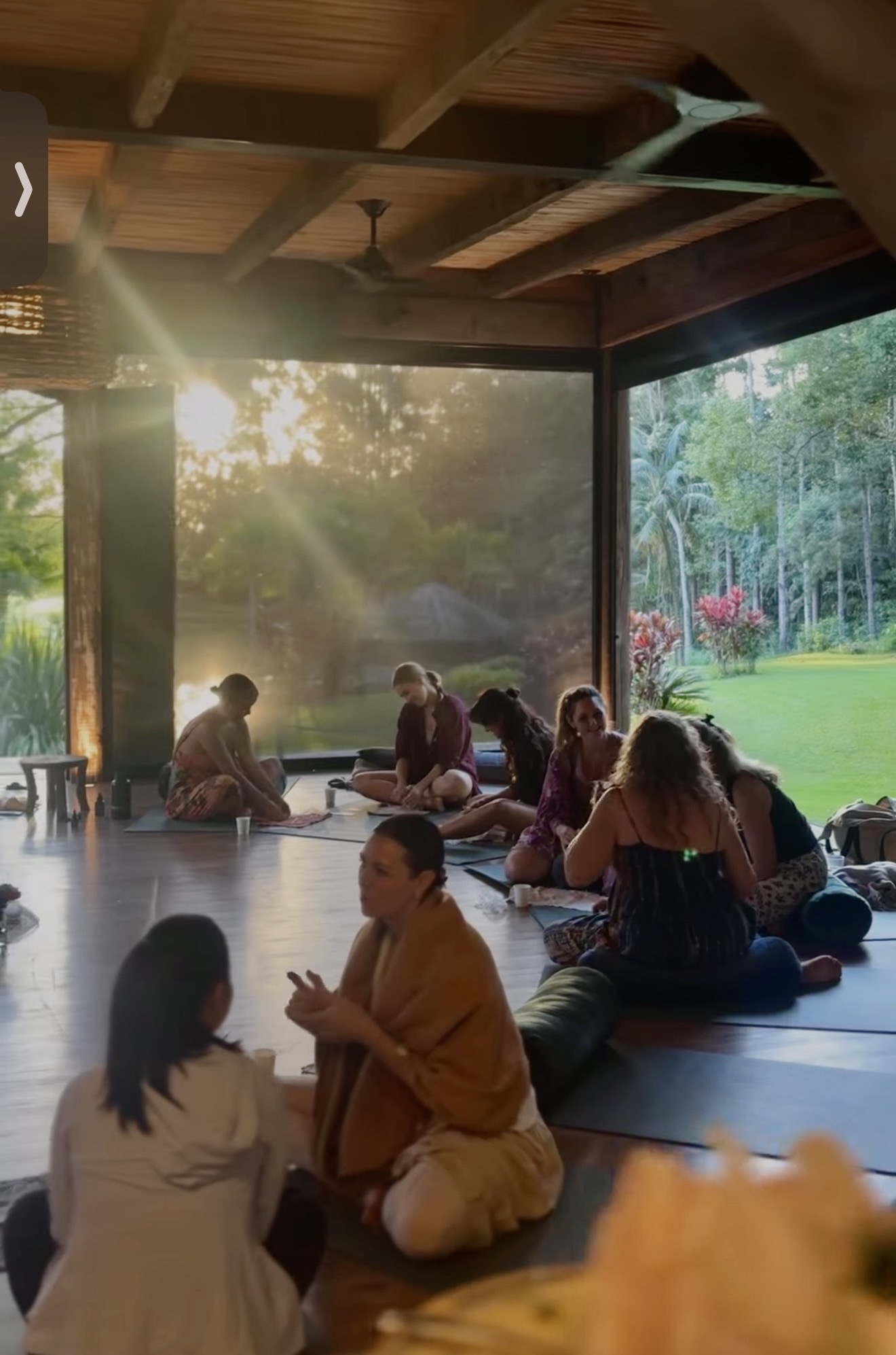 Women's circle at golden hour in the shala
