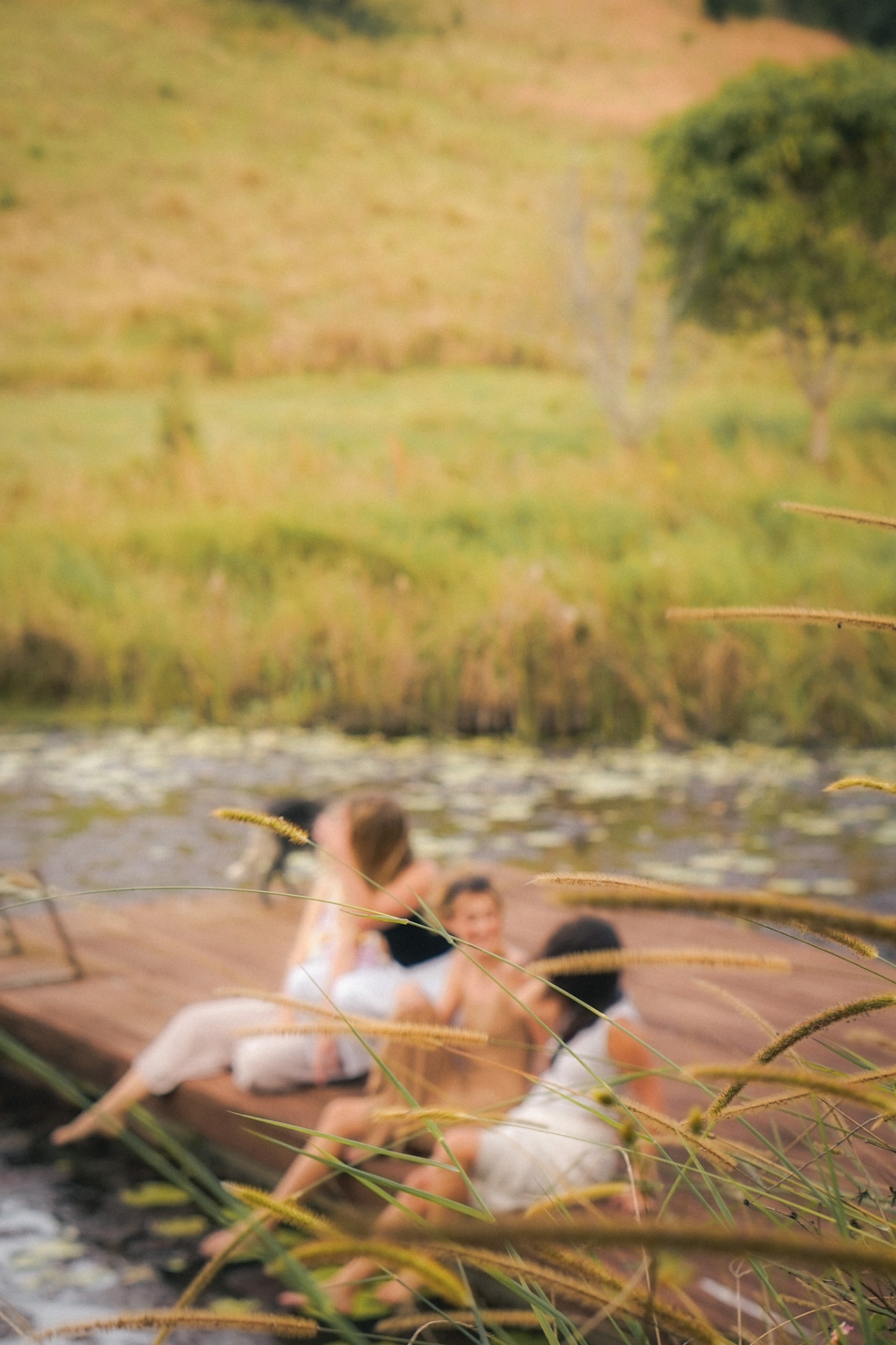 Soft-focus women gathered by the water during an Elementa retreat