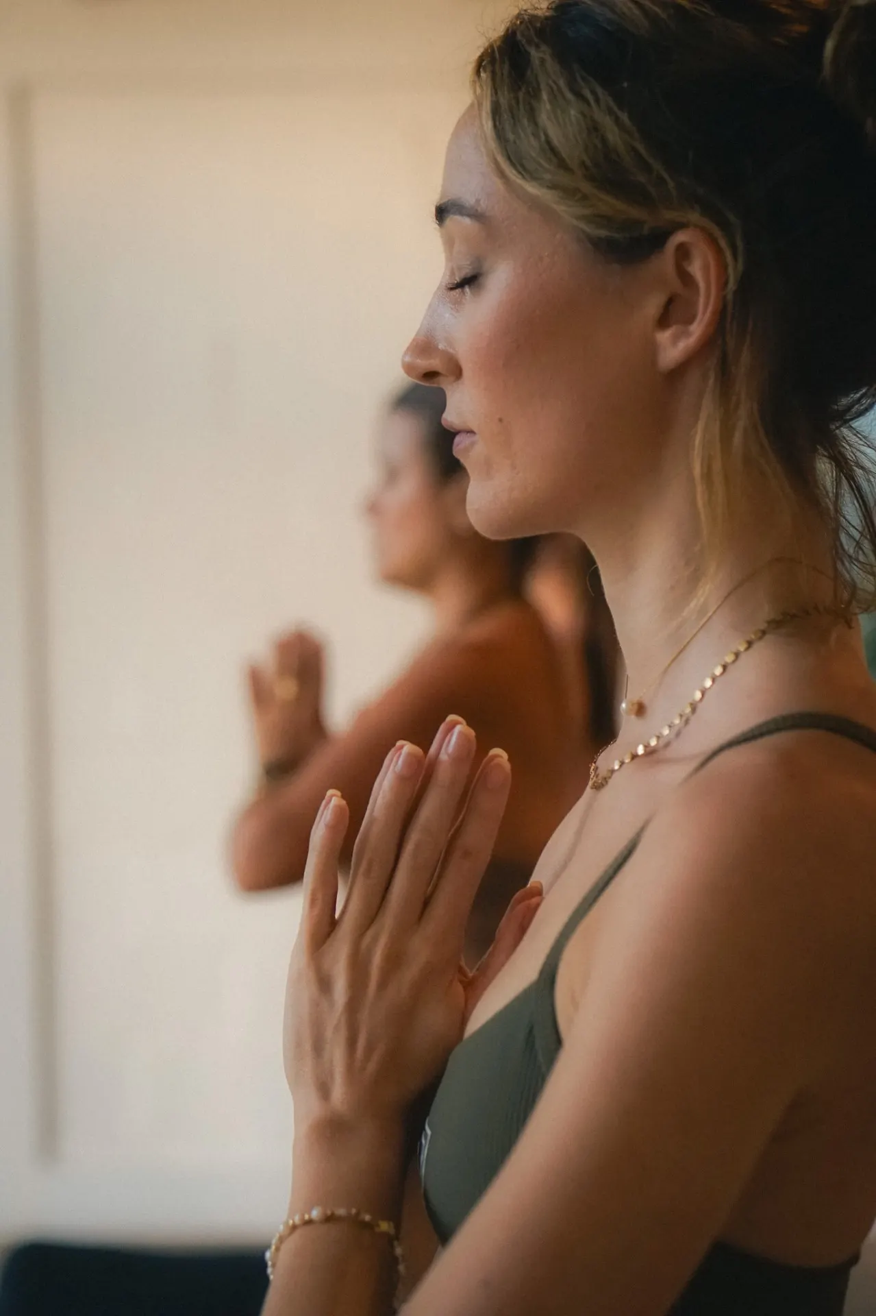 Close portrait of a woman in meditation at an Elementa event