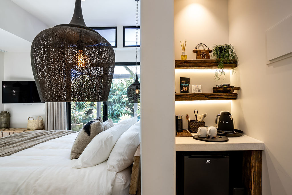 Suite interior with Moroccan pendant and kitchenette